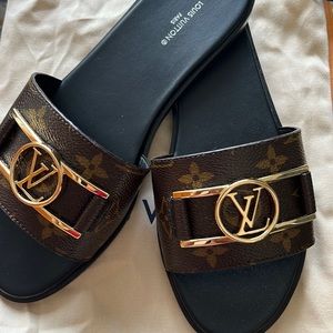Brand new size 38 Louis Vuitton Lock It Flat Mule
